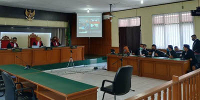  Sidang Perdana Digelar Virtual, Bupati Bengkalis Nonaktif Amril Didakwa Terima Suap